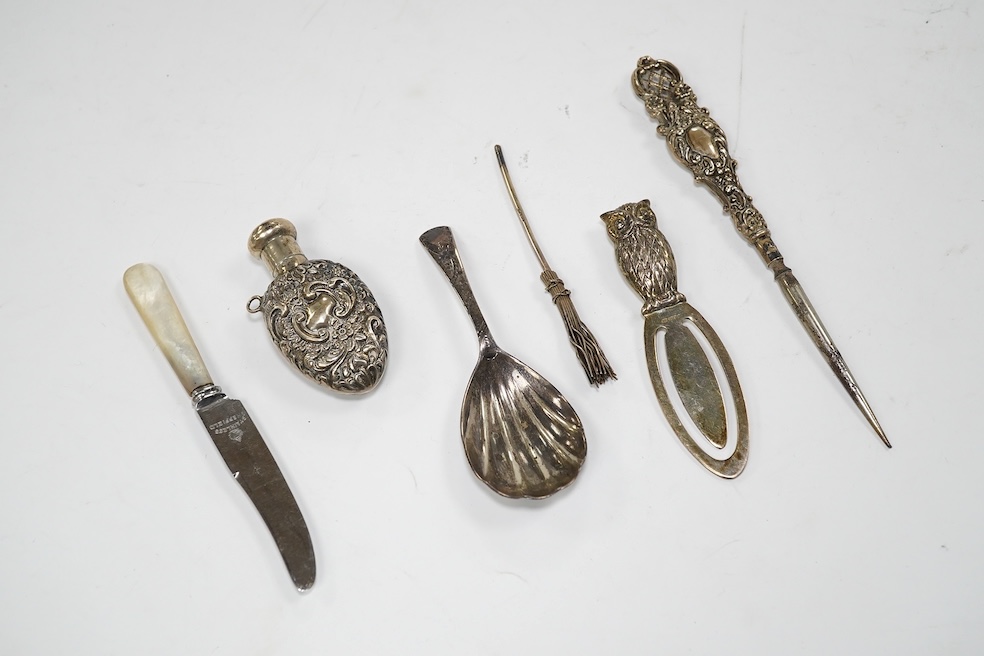 A group of assorted small silverware including inkwell, owl bookmark, scent flask, pepperette, thimble etc. Condition - poor to fair